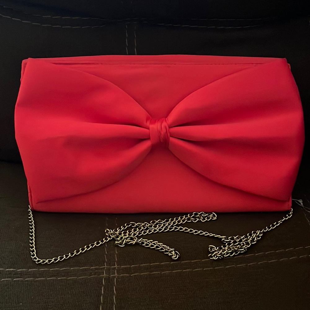 Hot pink clutch bag with strap